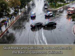 Overhead scene of car crash on rainy Claremont, California street, highlighting wet weather hazards for personal injury awareness.