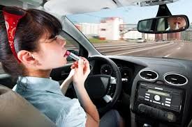 Increased Probability of Auto Accidents by Applying Makeup while driving
